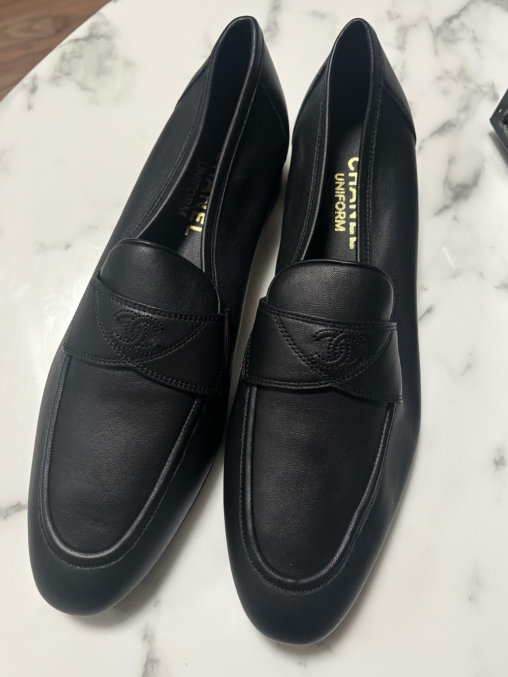 CHANEL Black Leather Penny Loafers with CC Emblem